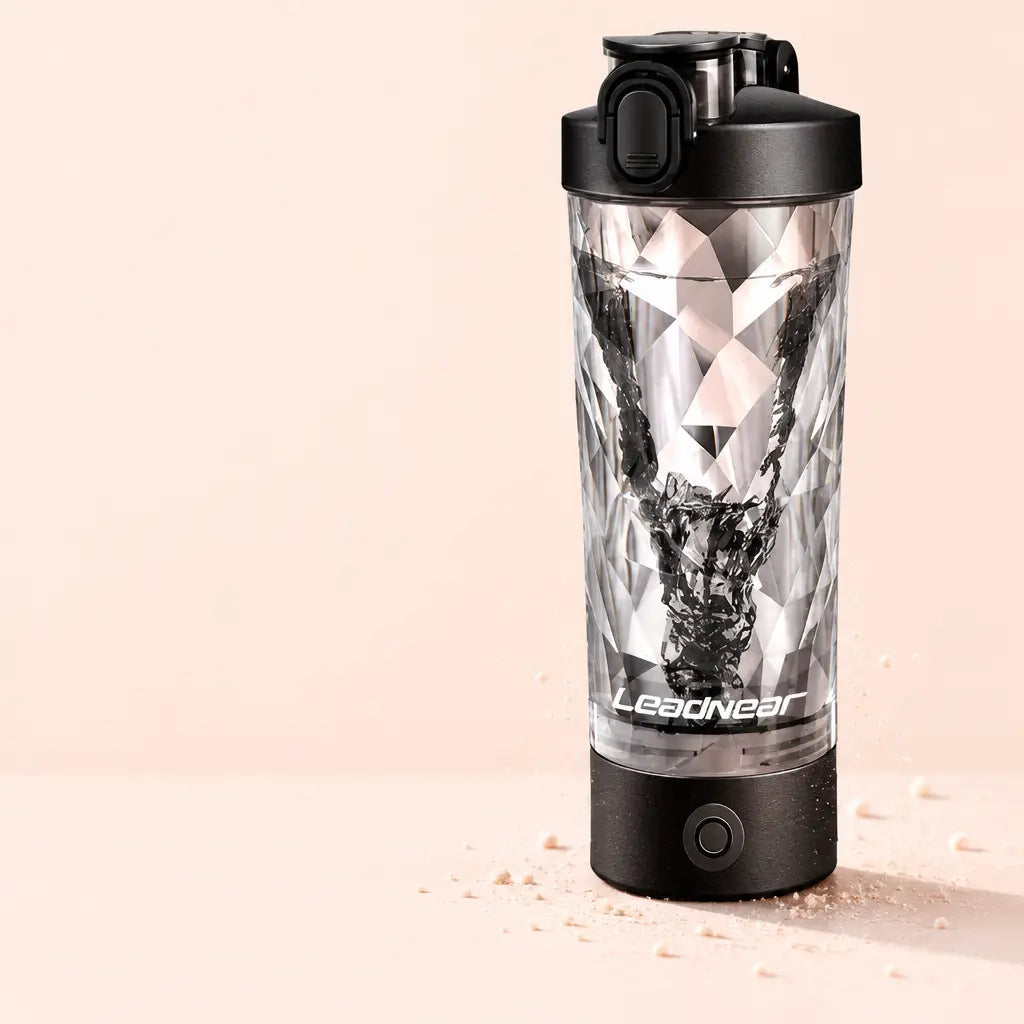 A studio photograph of the reference Blendiva electric shaker, its clear geometric-faceted cup, blac